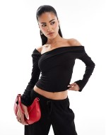 exclusive ribbed asymmetric off shoulder long sve top and trouser co-ord in black